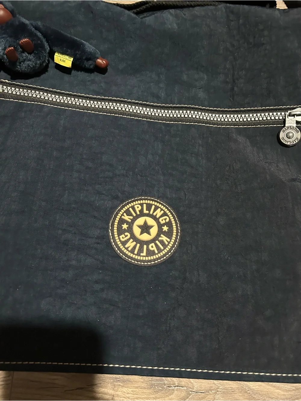 Kipling Dark Blue Expandable Messenger Bag with Monkey Charm